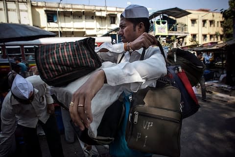 Dabbawallas at work - Credit: Getty