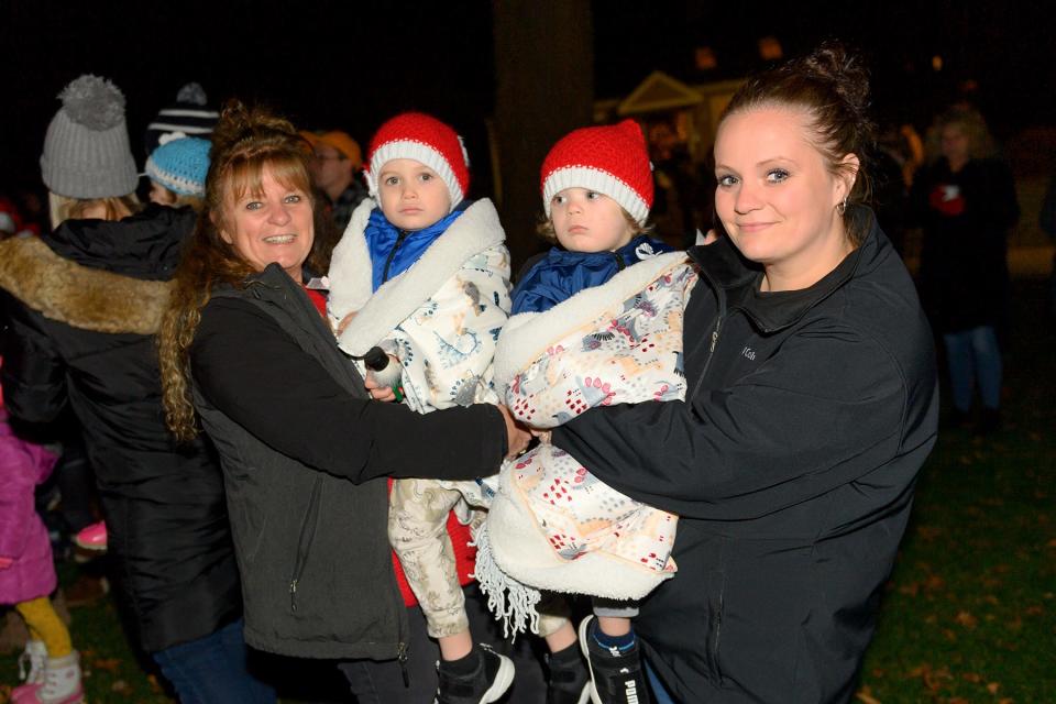 The Lakeville Lions Club held their third annual Christmas tree lighting event on Saturday, Dec. 4 at the club's Main Street headquarters. Sheri and Brittni hold Vincent and Jameson while waiting on the tree to light.