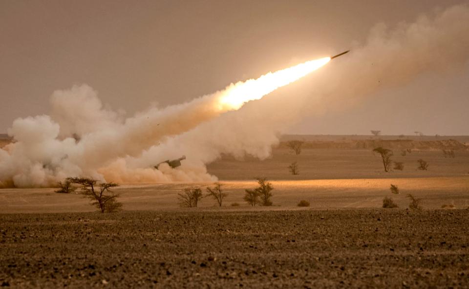 US M142 High Mobility Artillery Rocket System (HIMARS) launchers fire salvoes during the "African Lion" military exercise in the Grier Labouihi region in southeastern Morocco on June 9, 2021