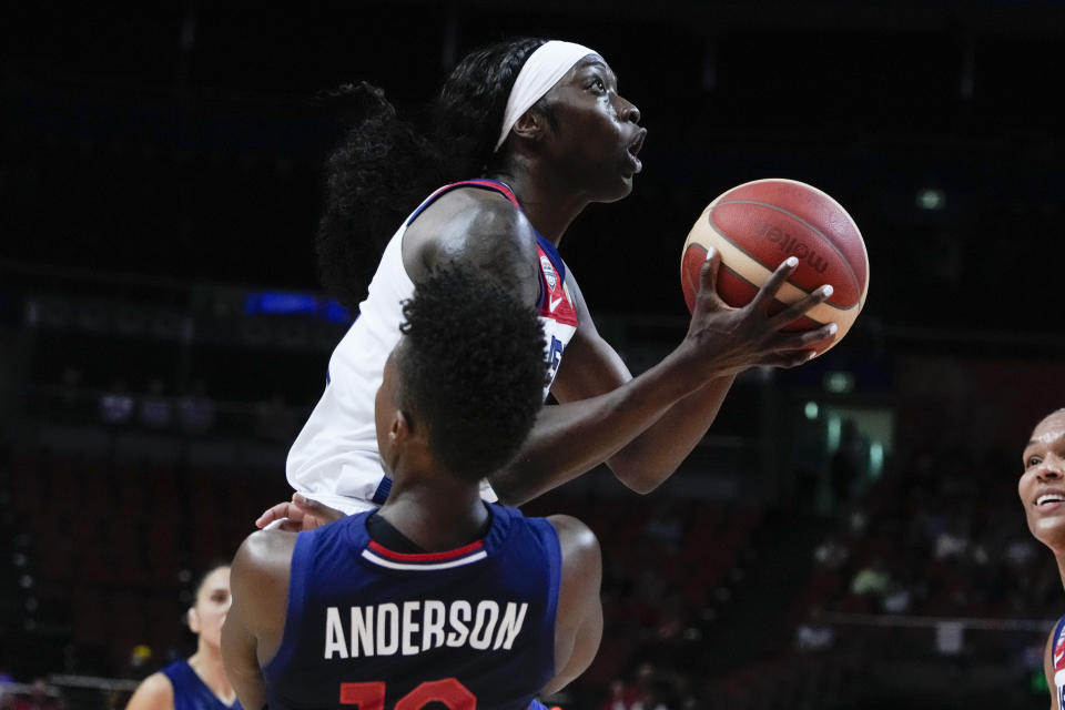 United States' Kahleah Copper collides with Serbia's Yvonne Anderson as she shoots for goal during their quarterfinal game at the women's Basketball World Cup in Sydney, Australia, Thursday, Sept. 29, 2022. (AP Photo/Mark Baker)