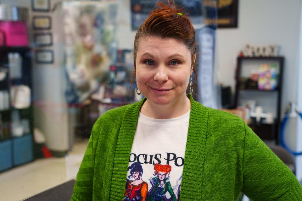 Spooky's Swirls Gluten Free Bakery chef and owner, Lola Forbes, poses for a portrait in her store on Oct. 28, 2022, in Chandler, Ariz.