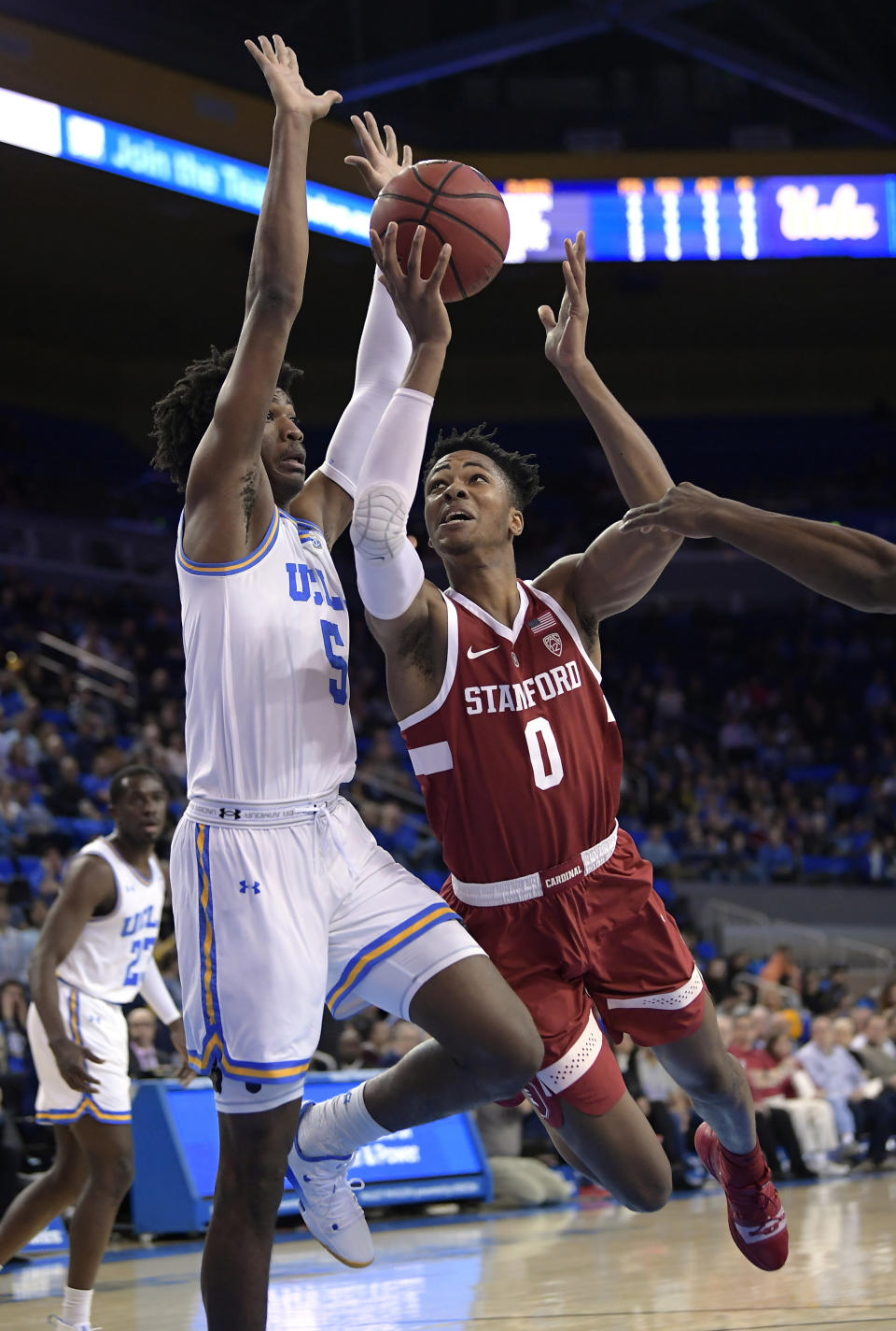 FILE - In this Jan. 3, 2019, file photo, Stanford forward KZ Okpala, right, shoots as UCLA guard Chris Smith defends during the first half of an NCAA college basketball game, in Los Angeles. Okpala is one of the top forwards in Thursday's NBA draft. (AP Photo/Mark J. Terrill, File)