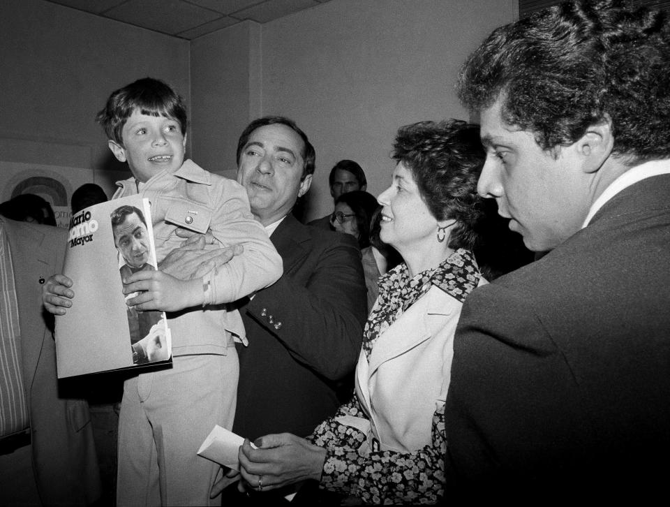 FILE — In this 1977 file photo, New York Secretary of State Mario Cuomo, is shown during a press conference with his family. He holds up his son Christopher, 6, as his wife Matilda, and son Andrew, 19, look on, during his run for mayor of New York City. New York’s attorney general has promised a thorough investigation of allegations that Cuomo sexually harassed at least two women. (AP Photo, File)