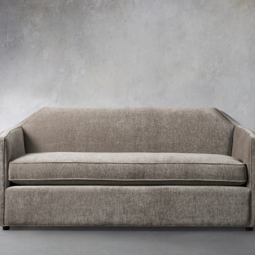 light brown marina sofa against gray wall