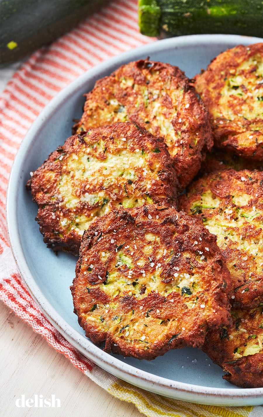 <p>These fritters taste like summer!</p><p>Get the recipe from <a href="https://www.delish.com/cooking/recipe-ideas/a27572667/easy-zucchini-cakes-recipe/" rel="nofollow noopener" target="_blank" data-ylk="slk:Delish;elm:context_link;itc:0;sec:content-canvas" class="link ">Delish</a>.</p>