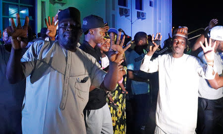 Supporters of Nigeria's President Muhammadu Buhari celebrate at the campaign headquarters of the All Progressives Congress (APC) party in Abuja, Nigeria February 26, 2019. REUTERS/Nneka Chile