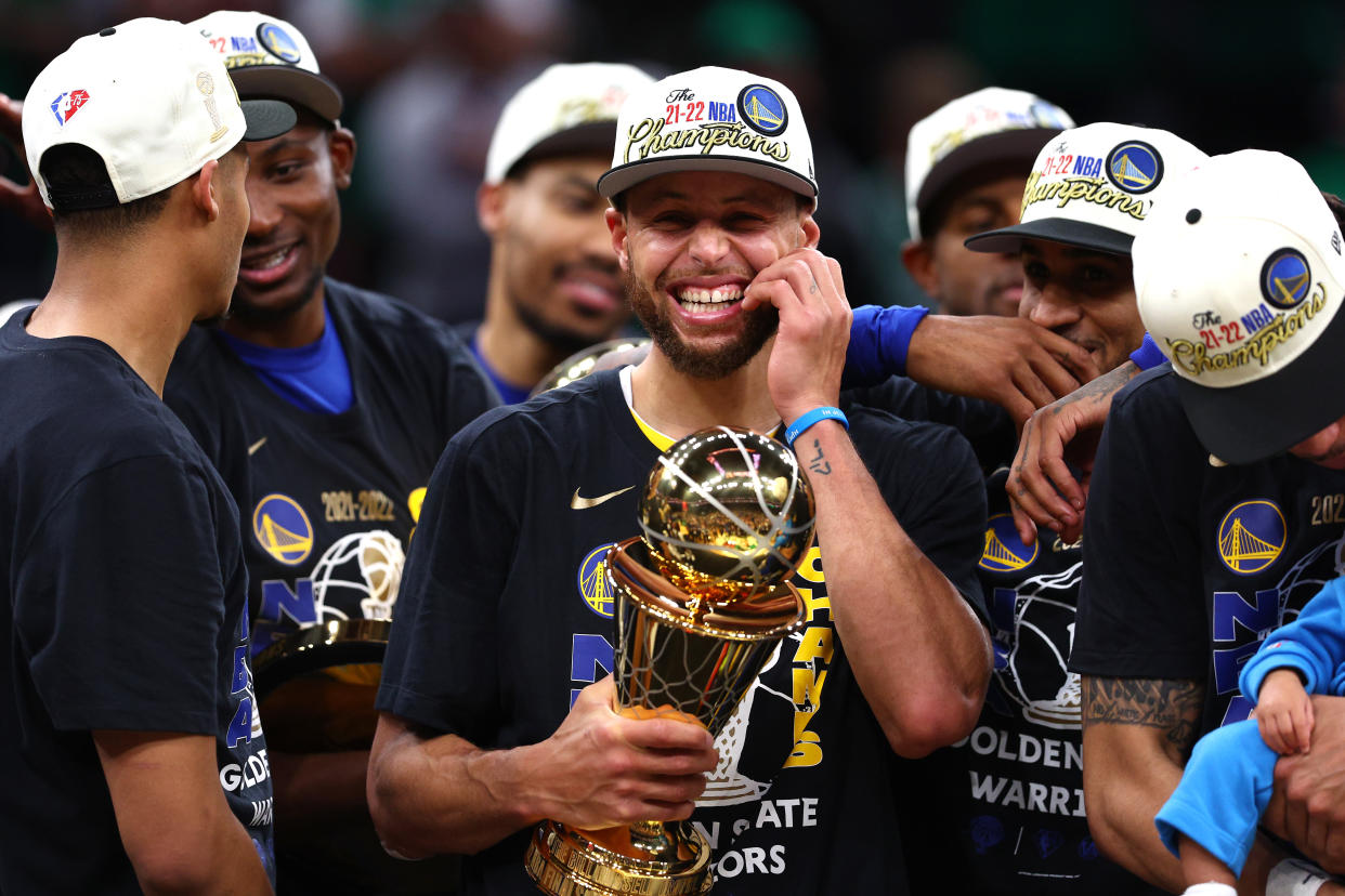 Golden State Warriors superstar Stephen Curry celebrates after the Warriors won the 2022 NBA championship and he won the Finals MVP on June 16, 2022. (Elsa/Getty Images)