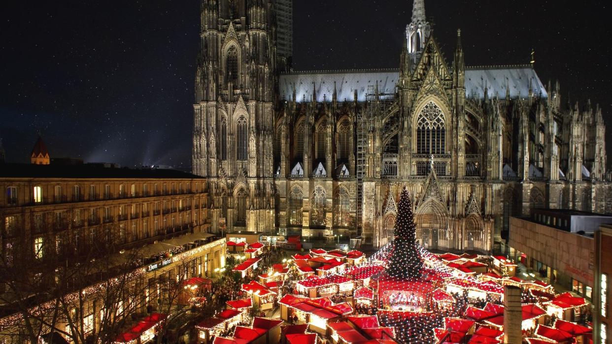 panorama view of cologne cathedral christmas market with illumination, christmas tree and world heritage cologne cathedral