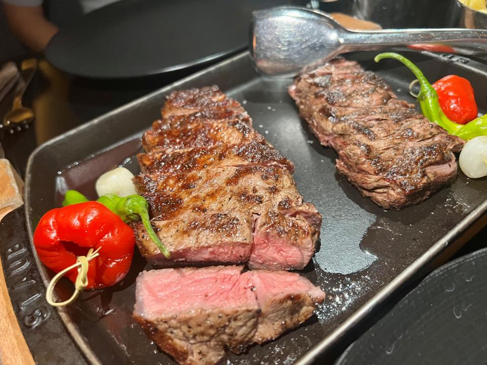 New York strip, left, and rib cap at Bourbon Steak by Michael Mina in the downtown J.W. Marriott Nashville  Sept. 5, 2023