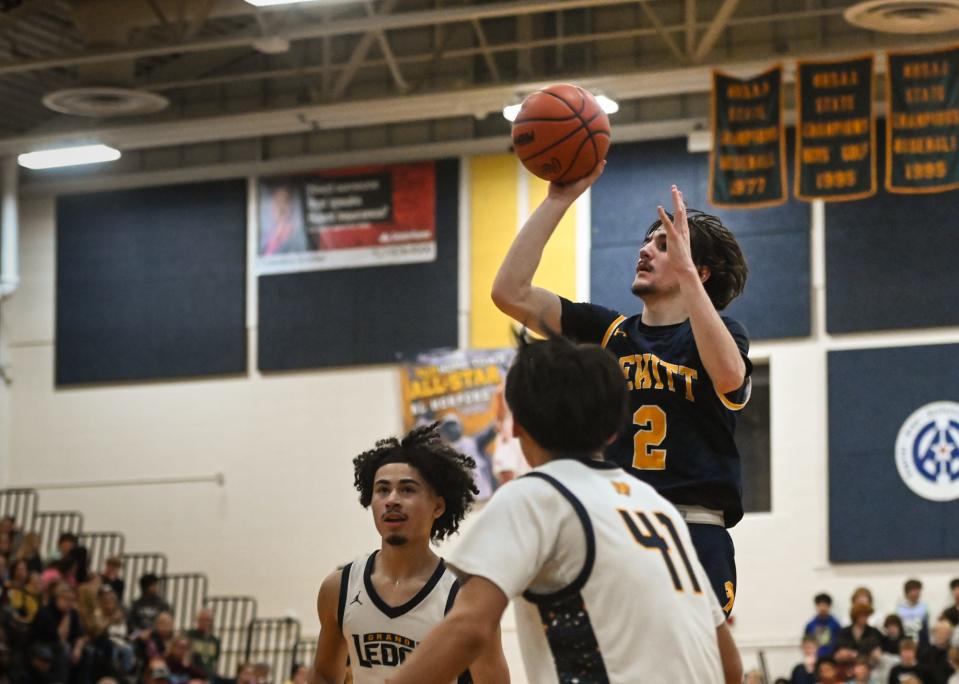 Adam Flannery of DeWitt drops in two against Grand Ledge, Friday, Dec. 15, 2023, at Grand Ledge. DeWitt won 60-50.