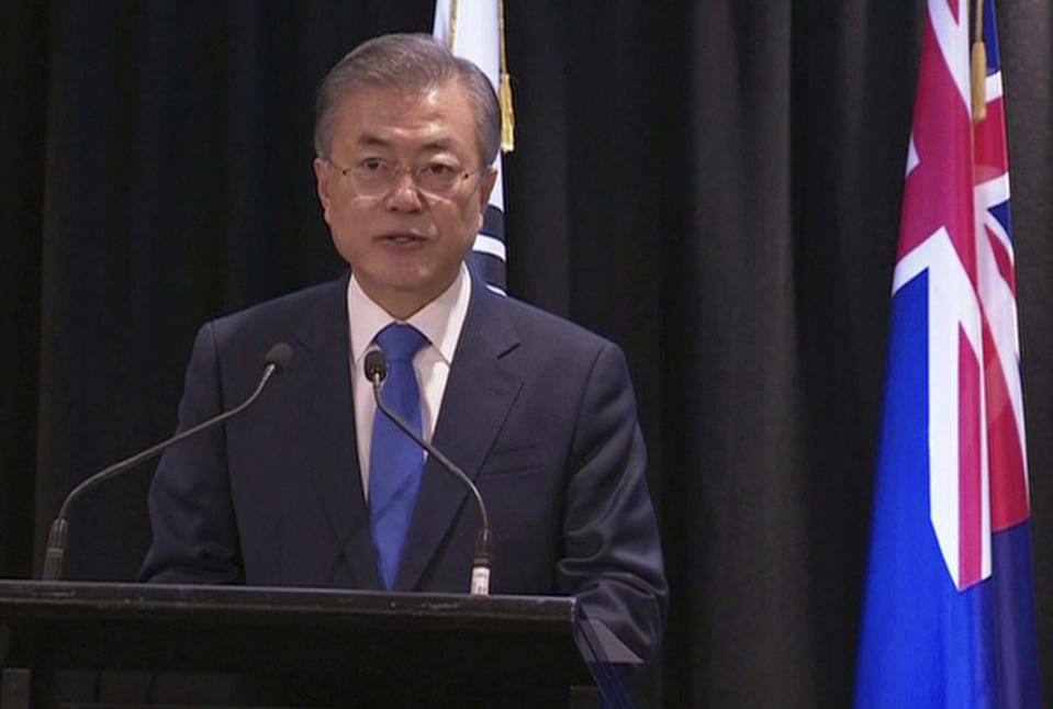 In this image made from a video, South Korean President Moon Jae-in speaks during a joint news conference with New Zealand's Prime Minister Jacinda Ardern in Auckland, New Zealand Tuesday, Dec. 4, 2018. Ardern says New Zealand will soon allow smoother immigration procedures for visitors from South Korea and plans to improve pension portability between the two countries. (NZ POOL via AP)