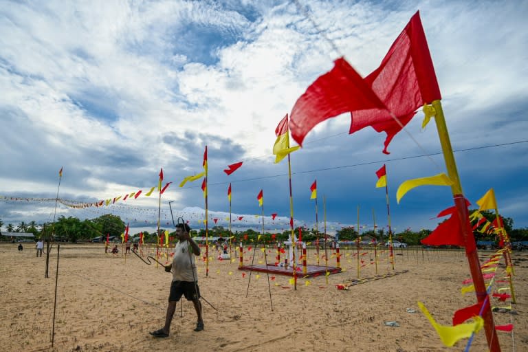 Volunteers prepare a venue on the eve of a commemoration ceremony at Mullivaikkal village in northern Sri Lanka on May 17, 2024 (Ishara S. KODIKARA)