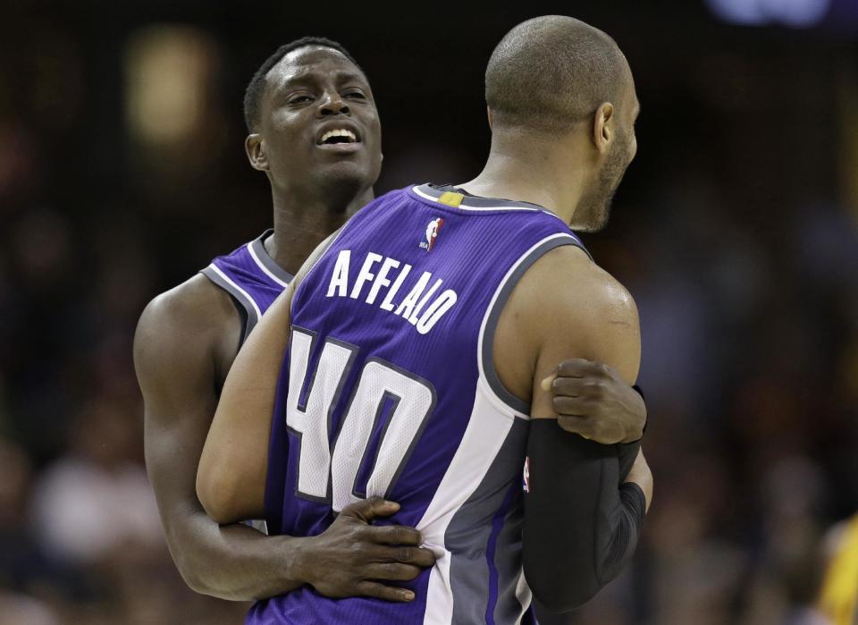 Sacramento Kings' Darren Collison, left, hugs Arron Afflalo after Afflalo hit a 3-point shot in overtime during the team's NBA basketball game against the Cleveland Cavaliers, Wednesday, Jan. 25, 2017, in Cleveland. The Kings won 116-112. (AP Photo/Tony Dejak)