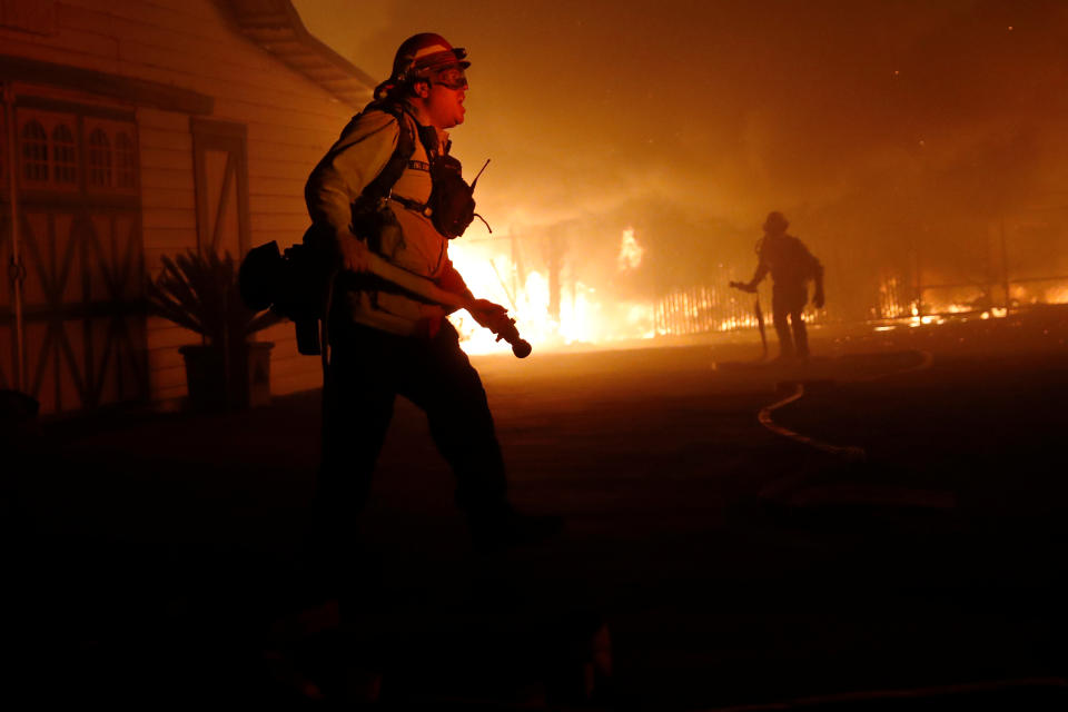 A firefighter gives orders as he battles the wind-driven Kincade Fire in Windsor, California, Oct. 27, 2019. (Photo: Stephen Lam/Reuters)