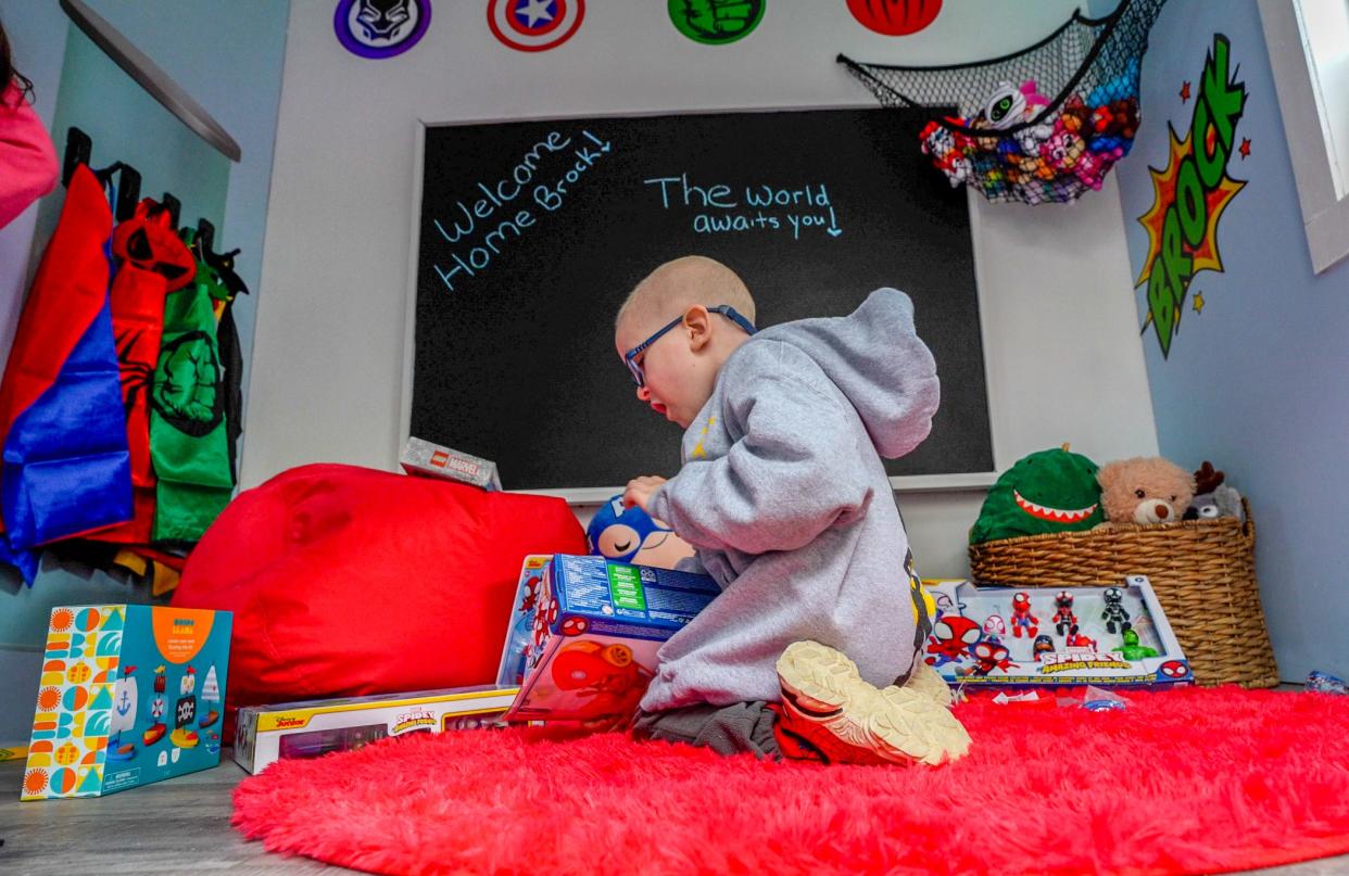 Brock Nowicki, 4 years old, of West Greenwich, gets down to business Thursday in his new superhero-themed Avengers tower playhouse.