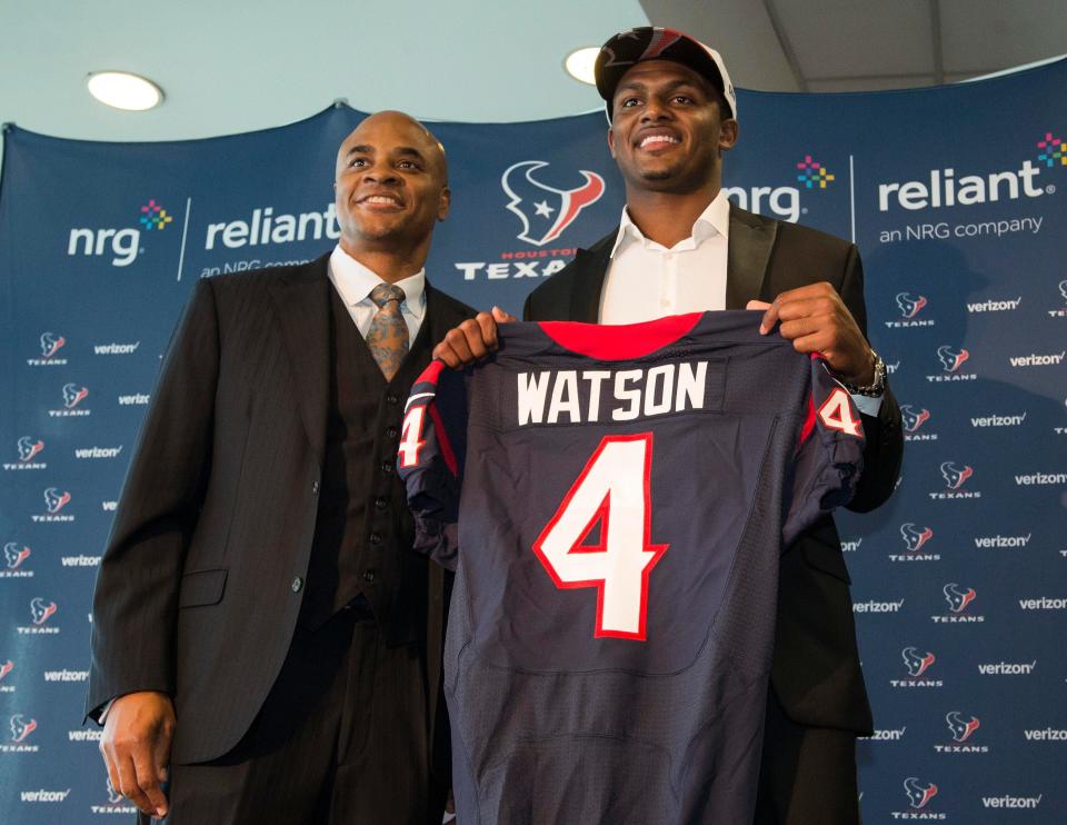 Houston Texans general manager Rick Smith (left) and first-round draft pick Deshaun Watson pose for a picture during a press conference at NRG Stadium.