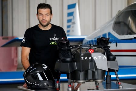 French inventor Franky Zapata poses with a a Flyboard during a news conference as he prepares to cross the English channel from Sangatte in France to Dover, at the Saint-Inglevert aerodrome