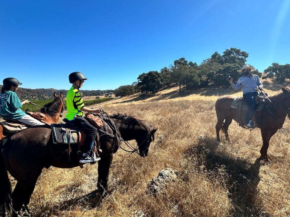 The Wagland boys take instructions from ranch owner Brian (Elliot Wagland)