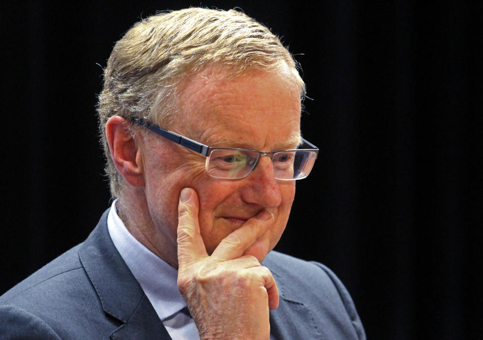 Reserve Bank of Australia governor Philip Lowe smiles. The RBA's inflation predictions improved in 2022.