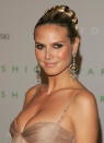 <p>Glamazon Heidi Klum also worked the slick up-do and braid bun.</p>