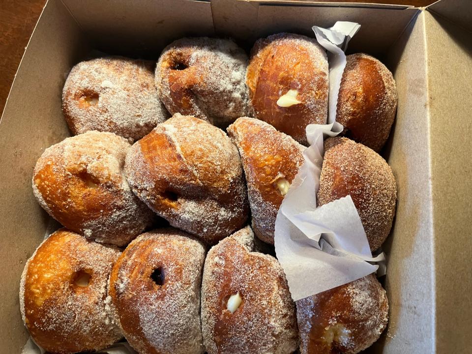 A box full of malasada donuts.