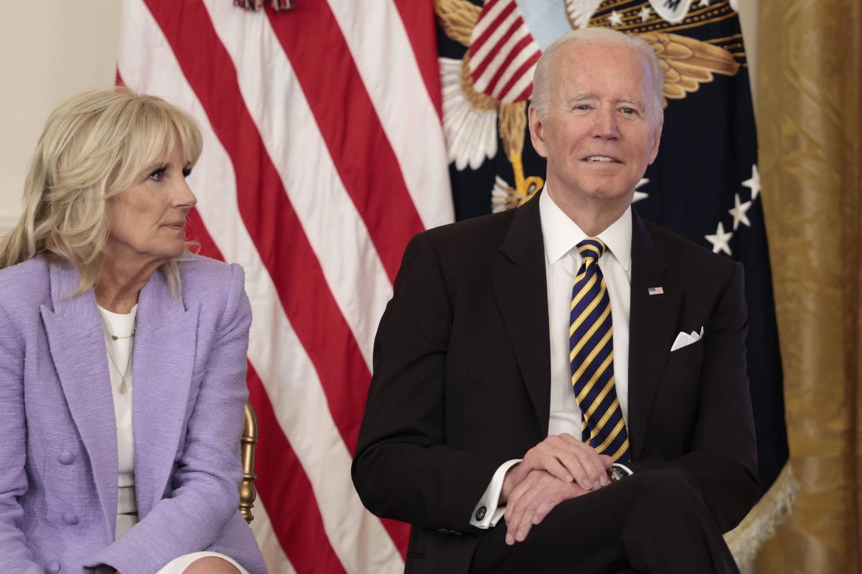 U.S. First Lady Jill Biden and U.S. President Joe Biden listen during an event for the 2022 National and State Teachers of the Year in the East Room of the White House on April 27, 2022, in Washington, DC.