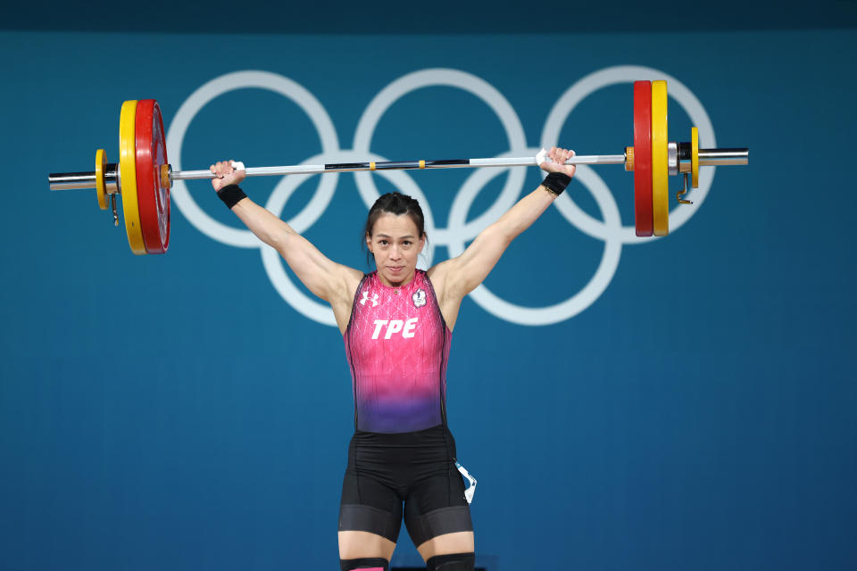 PARIS, FRANCE - AUGUST 08: Hsing-Chun Kuo of Team Chinese Taipei performs a snatch during the Weightlifting Women's 59kg on day thirteen of the Olympic Games Paris 2024 at South Paris Arena on August 08, 2024 in Paris, France. (Photo by Matthew Stockman/Getty Images)