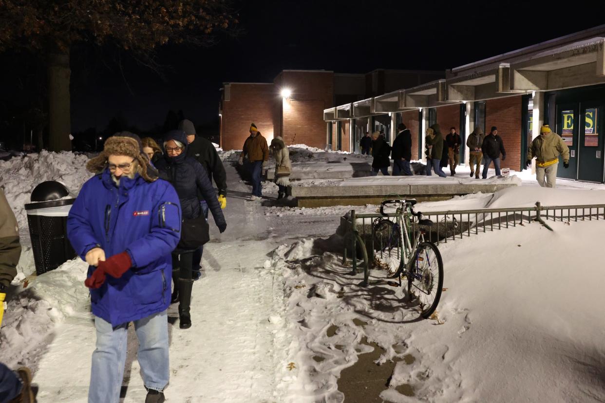 Des Moines voters brave frigid weather to support their favorite candidates at Hoover High School.