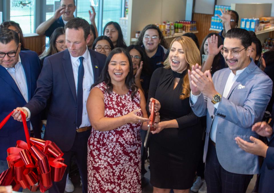 State Assemblymember Eduardo Garcia (left), California Chief Service Officer Josh Fryday, Find Food Bank CEO Debbie Espinosa, COD Superintendent/President Martha Garcia and Board Chair Ruben Perez celebrate the pantry's grand opening with students.