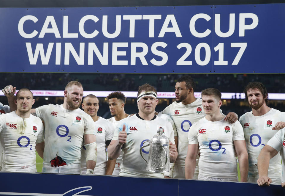 England's Dylan Hartley holds up the Calcutta Cup after his team won the Six Nations rugby union international between England and Scotland 61-21at Twickenham stadium in London, Saturday March 11, 2017.. (AP Photo/Alastair Grant)