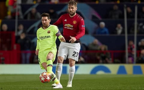 Luke Shaw of Manchester United competes for the ball with Lionel Messi of FC Barcelona during the UEFA Champions League Quarter Final first leg match between Manchester United and FC Barcelona - Credit: Getty images