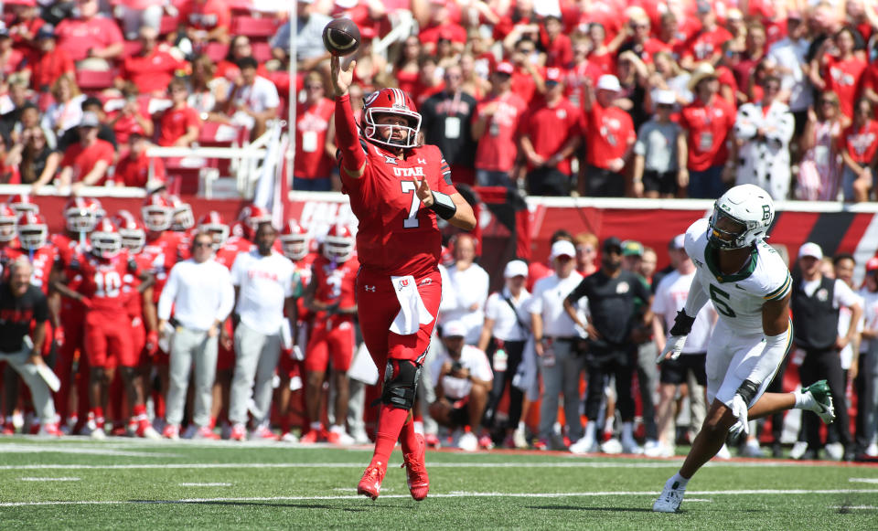 SALT LAKE CITY, UT – SEPTEMBER 7: Cameron Rising #7 of the Utah Utes throws a touchdown pass under pressure from Garmon Randolph #5 of the Baylor Bears during the first half of their game at Rice Eccles Stadium on September 7, 2024 in Salt Lake City, Utah. (Photo by Chris Gardner/Getty Images)