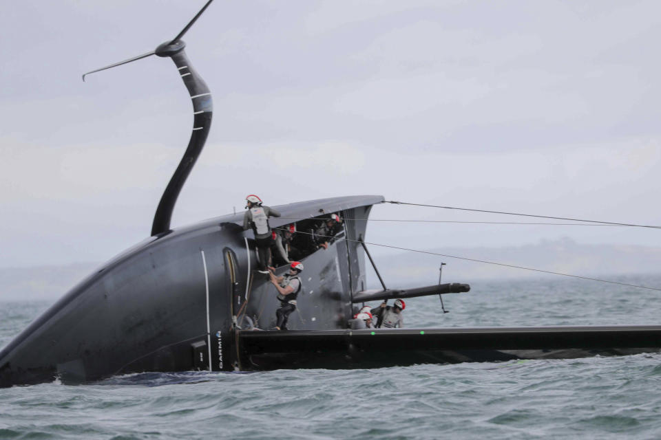 United States' American Magic capsizes during it's race against Italy's Luna Rossa on the third day of racing of the America's Cup challenger series on Auckland's Waitemate Harbour, New Zealand, Sunday, Jan. 17, 2021. (Michael Craig/NZ Herald via AP)