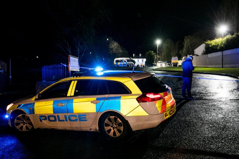 Police at the entrance of the Greenvale Hotel in Cookstown (PA)