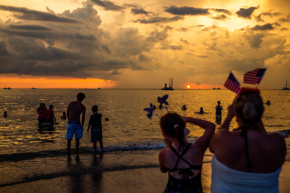 Families gather to celebrate Independence Day at Naples Pier on Thursday, July 4, 2019. 