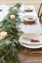 <p>Want to give your garland a second life? Instead of draping it on your mantel or stair rail, layer it along your dining room table. For a setup that’s stylish <em>and</em> soothing, add a few tea lights to the mix.</p><p><a href="https://julieblanner.com/garland-centerpiece/" rel="nofollow noopener" target="_blank" data-ylk="slk:Via Julie Blanner;elm:context_link;itc:0;sec:content-canvas" class="link "><em>Via Julie Blanner</em></a></p>