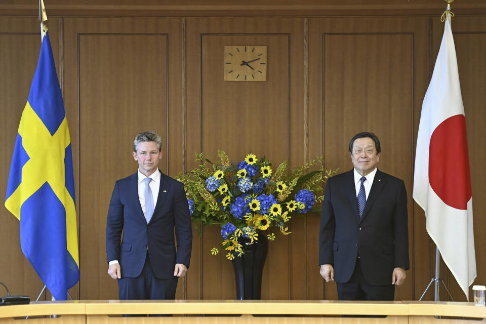 Sweden's Defense Minister Pal Jonson, left, and Japanese Defense Minister Yasukazu Hamada, right, pose for a photo, ahead their bilateral meeting at the Defense Ministry Wednesday, June 7, 2023, in Tokyo, Japan. (David Mareuil/Pool Photo via AP)