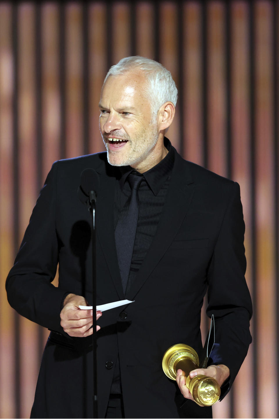 This image released by NBC shows Martin McDonagh accepting the Best Screenplay award for "The Banshees of Inisherin" during the 80th Annual Golden Globe Awards at the Beverly Hilton Hotel on Tuesday, Jan. 10, 2023, in Beverly Hills, Calif. (Rich Polk/NBC via AP)