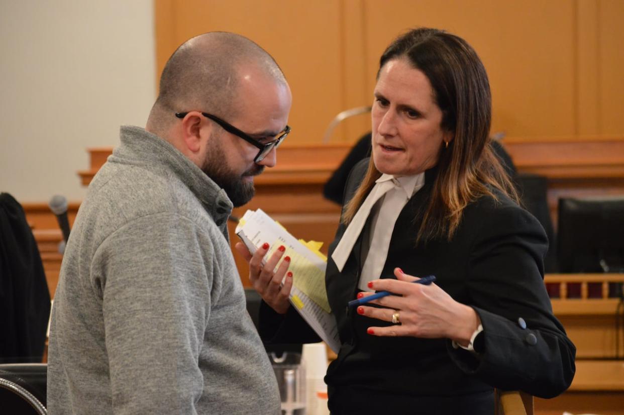 Matthew Power, 29, and lawyer Rosellen Sullivan are pushing to have several of his charges dismissed. Power has been on trial since last week, accused of sex crimes against minors. (Malone Mullin/CBC - image credit)