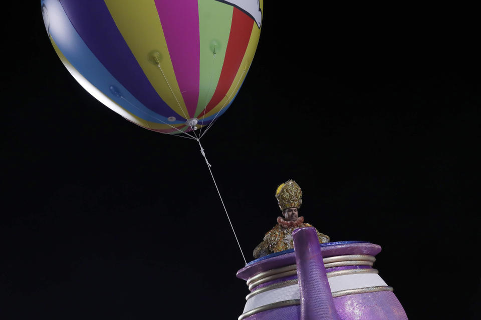 A performer from the Imperatriz Leopoldinense samba school parades on a float during Carnival celebrations at the Sambadrome in Rio de Janeiro, Brazil, Tuesday, Feb. 21, 2023. (AP Photo/Bruna Prado)