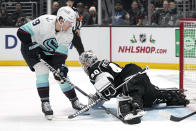 Seattle Kraken center Ryan Donato, left, tries to score on Los Angeles Kings goaltender Cal Petersen during the third period of an NHL hockey game Tuesday, Nov. 29, 2022, in Los Angeles. (AP Photo/Mark J. Terrill)