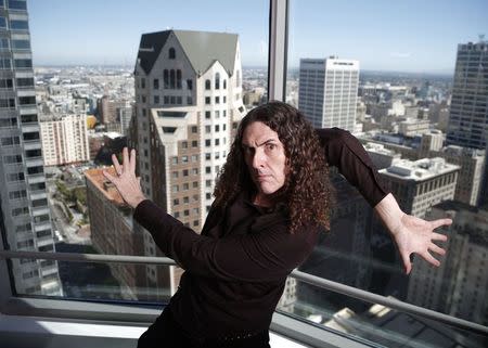 Musician "Weird Al" Yankovic poses for a portrait in the Reuters bureau in Los Angeles, California July 24, 2014. REUTERS/Lucy Nicholson