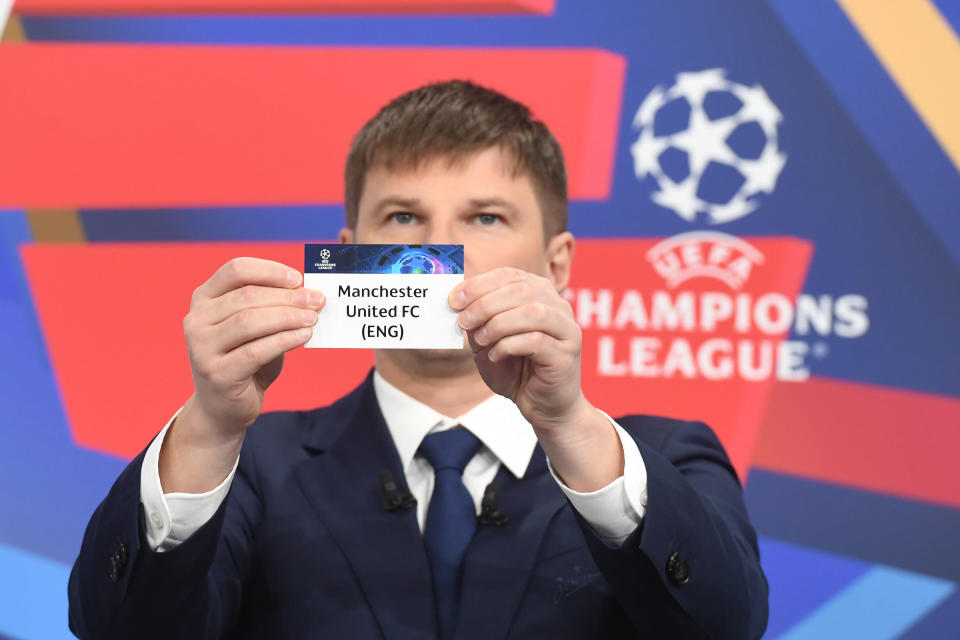 Special guest Andrey Arshavin draws out the card of Manchester United FC during the UEFA Champions League 2021/22 Round of 16 Draw.