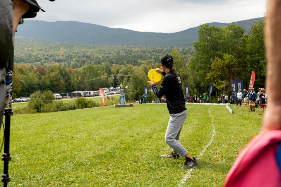 A competitor in the 2022 Green Mountain Championship prepares to throw on the course at Smugglers' Notch Ski Resort.