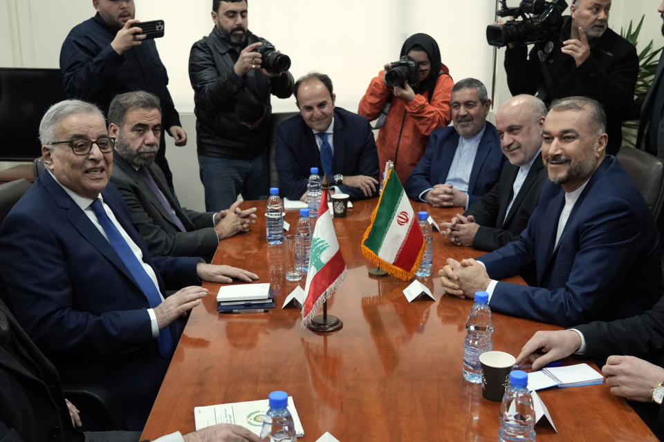 Lebanese Foreign Minister Abdallah Bouhabib, left, meets with his Iranian counterpart Hossein Amirabdollahian in Beirut, Lebanon, Friday, Jan. 13, 2023. Amirabdollahian said talks between regional rivals Iran and Saudi Arabia are continuing and could eventually restore diplomatic relations that were severed years ago. (AP Photo/Bilal Hussein)