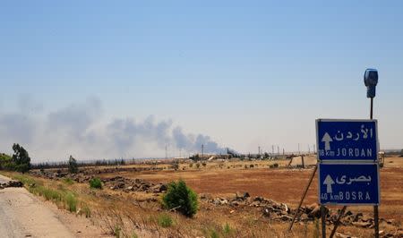 Smoke is seen over Deraa area, Syria July 5, 2018. Picture taken July 5, 2018. SANA/ Handout via Reuters