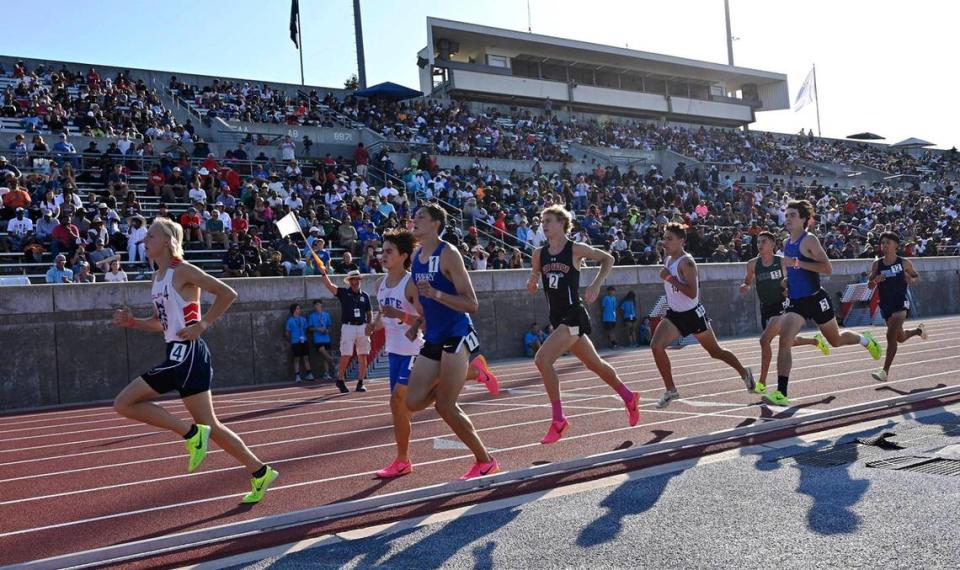 Runners circle the track at Buchanan’s Veteran’s Memorial Stadium during the 2023 CIF California Track & Field State Championship qualifiers Friday, May 26, 2023 in Clovis.