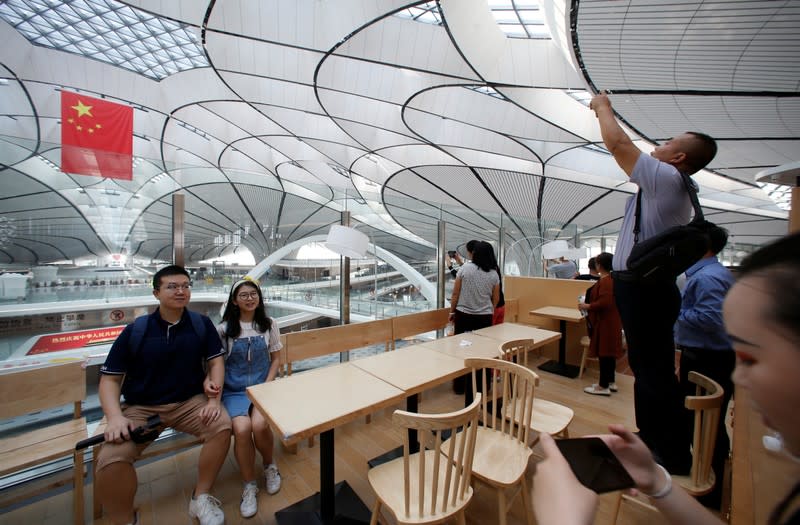 People visit the terminal hall of the newly launched Daxing International Airport on the outskirts of Beijing