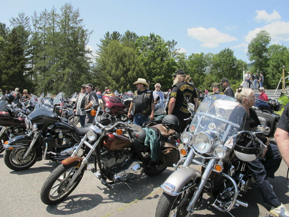 Motorcyclists attend the Blessing of the Bikes ceremony in Columbia, N.H. on Sunday, June 23, 2019. The long-planned ceremony for motorcycle enthusiasts became a scene of mourning and reflection as about 400 people paid tribute to seven bikers killed Saturday in a devastating collision with a pickup truck. (AP Photo/Lisa Rathke)