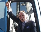 Coalition Avenir Quebec (CAQ) leader Francois Legault waves as he boards his campaign bus after Quebec's Premier Pauline Marois called an election in Quebec City, March 5, 2014. Quebec voters will head to the poll for a provincial election on April 7. REUTERS/Mathieu Belanger (CANADA - Tags: POLITICS ELECTIONS)